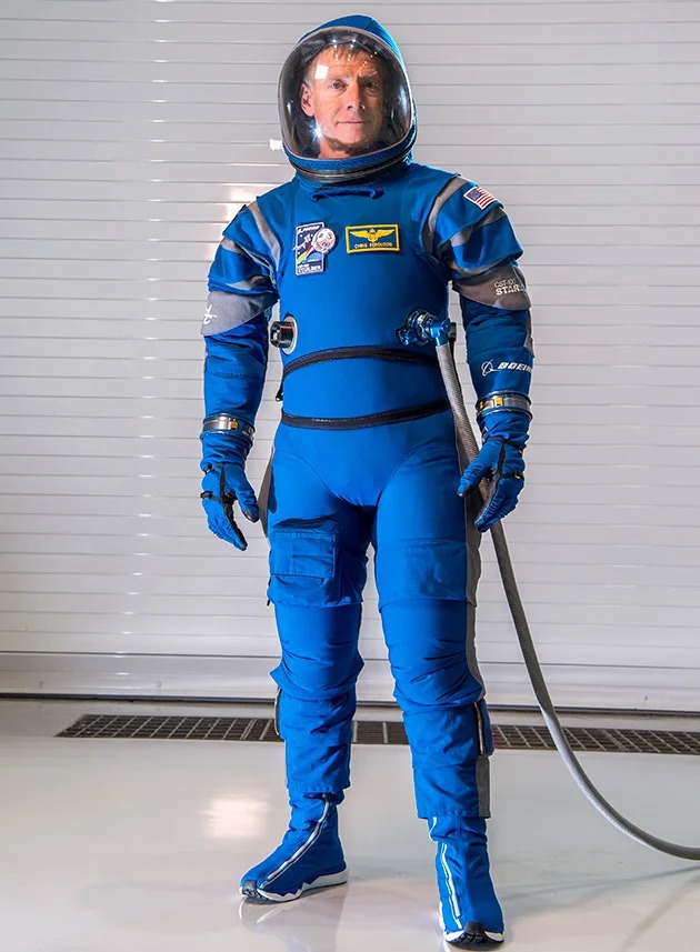 Bright blue fitting Boeing suit